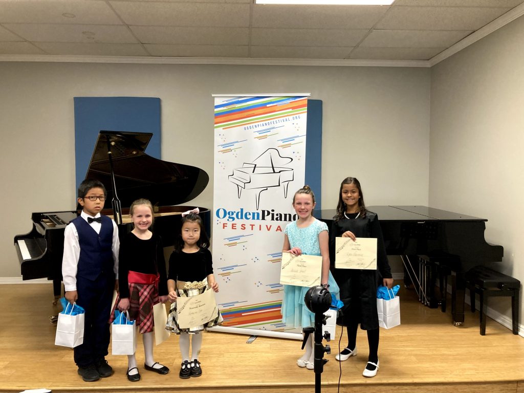 Young Elementary Solo division winners. 1st Place-Lydia Sheranian, 2nd Place-Maxwell Ji, 3rd Place-Adelaide Howell, Honorable Mention-Sabrina Howell, Honorable Mention-Katherine Gao