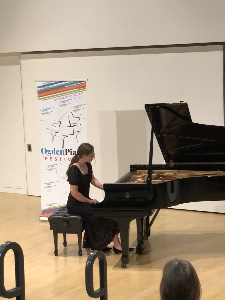 Emily Runov Performing at Steinway Grand Piano