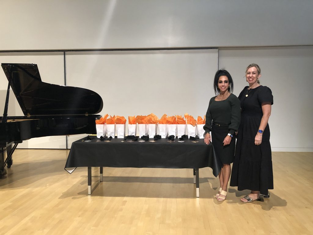 Judges with Prize Table L to R: Dr. Janae Codner Williams, Bridget Johansen