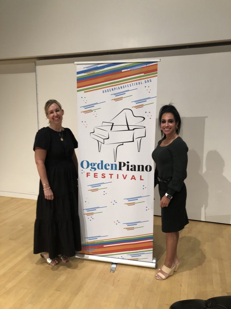 Judges Bridget Johansen and Dr. Janae Codner Williams with Ogden Piano Festival banner