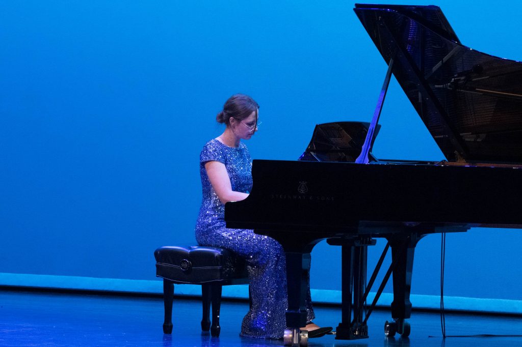 Emily Runov performs at the piano