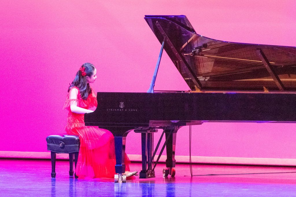 Christina Sung performing at the piano